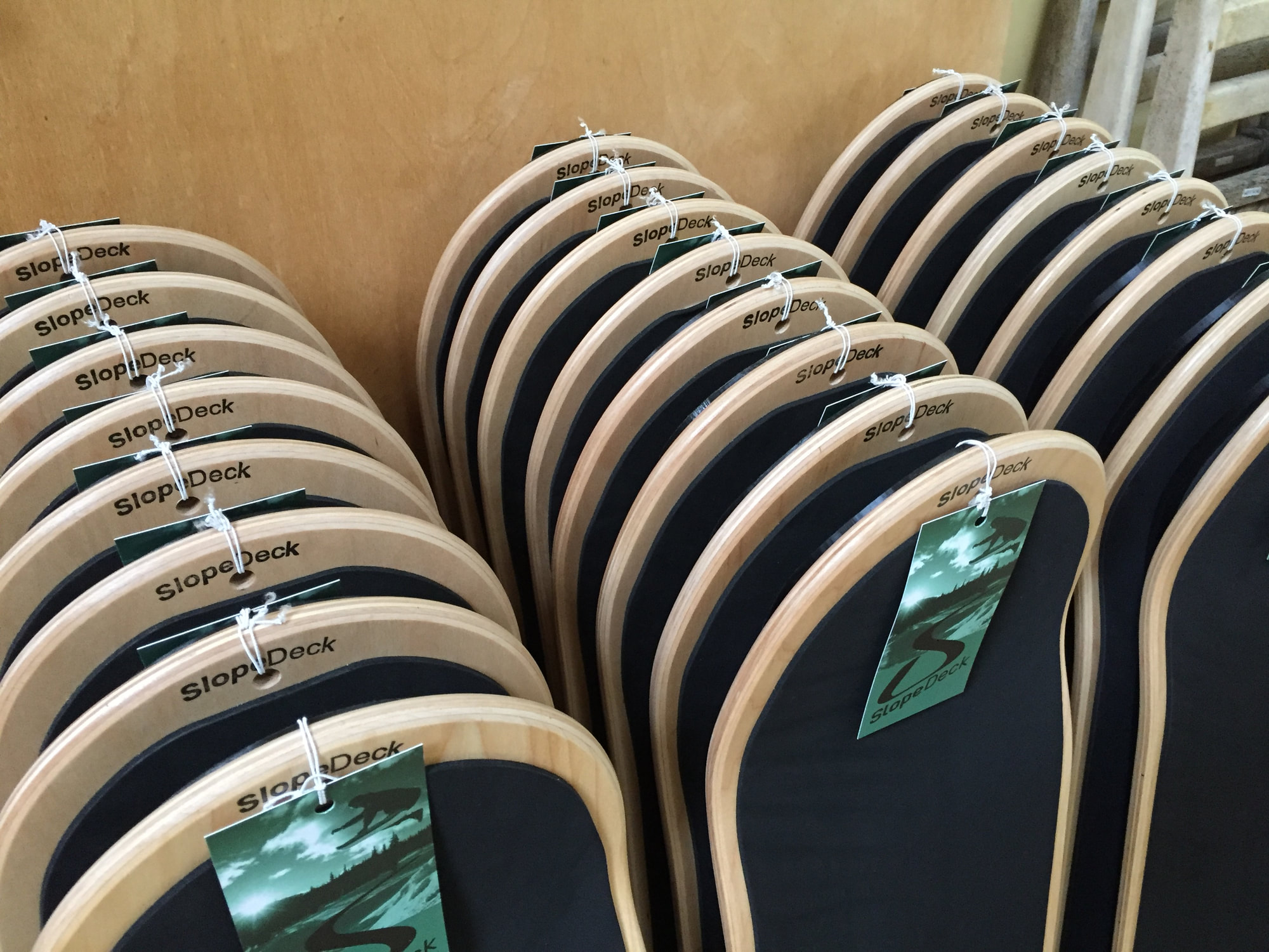 Rows of handmade SlopeDecks in the British Columbia workshop